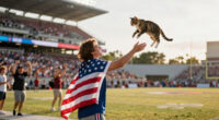 Fans Catch Falling Cat with American Flag at Miami Game
