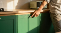 The Most Stunning Green Cabinets Gave A Dated Kitchen A Mid-Century Makeover