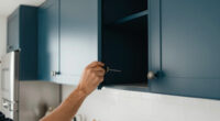 Dark Teal Cabinets Completely Changed This Dark, Dreary Kitchen